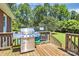 The deck has a gas grill and overlooks the backyard, perfect for outdoor dining and entertaining at 1105 S Point Rd, Belmont, NC 28012