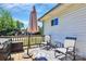 Inviting outdoor deck furnished with comfortable seating, a grill, and an umbrella for shade at 1105 S Point Rd, Belmont, NC 28012