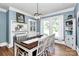 Elegant dining room with large windows, stylish lighting, and a classic dining set for entertaining at 1105 S Point Rd, Belmont, NC 28012