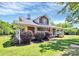 Beautiful home with a inviting porch and well-manicured landscaping, creating a warm and welcoming atmosphere at 1105 S Point Rd, Belmont, NC 28012