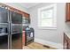 Traditional kitchen featuring wooden cabinets, gray walls, and stainless steel appliances at 1105 S Point Rd, Belmont, NC 28012