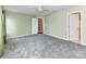 Spacious bedroom with neutral paint, plush carpet, and ceiling fan at 1124 Hunter St, Statesville, NC 28677
