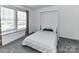 Bedroom featuring murphy bed, window, and carpet at 1124 Hunter St, Statesville, NC 28677