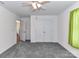 Bedroom featuring plush gray carpet, ceiling fan, and closet at 1124 Hunter St, Statesville, NC 28677