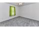 Neutral bedroom with plush carpet and single window at 1124 Hunter St, Statesville, NC 28677
