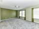 Spacious bedroom featuring soft carpeting, and large windows with ample natural light at 1124 Hunter St, Statesville, NC 28677
