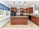 Well-appointed kitchen with granite countertops, a center island, and stainless steel appliances at 1124 Hunter St, Statesville, NC 28677
