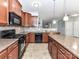 Well-equipped kitchen featuring granite counters, sleek appliances, and a convenient breakfast bar at 1124 Hunter St, Statesville, NC 28677