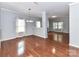 Bright living room with hardwood floors and white trim features plenty of natural light at 1124 Hunter St, Statesville, NC 28677