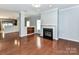 Spacious living room with hardwood floors, fireplace, and open layout is perfect for entertaining at 1124 Hunter St, Statesville, NC 28677