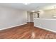 Open loft space featuring hardwood floors and neutral walls, offering versatile living area at 1124 Hunter St, Statesville, NC 28677