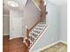 Elegant staircase featuring wood treads, white risers, and a stained handrail at 1124 Hunter St, Statesville, NC 28677