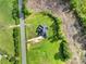 Overhead shot showcasing the home and its location with a long driveway and wooded surroundings at 1166 Rocky River Rd, Lancaster, SC 29720
