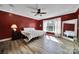 Bright bedroom featuring hardwood floors, large window, and neutral tones with ample natural light at 1166 Rocky River Rd, Lancaster, SC 29720
