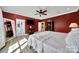 Bedroom with view to bathroom and with hardwood floors, large window, and neutral tones with ample natural light at 1166 Rocky River Rd, Lancaster, SC 29720