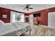 Cozy bedroom featuring hardwood floors, large window, and neutral tones with ample natural light at 1166 Rocky River Rd, Lancaster, SC 29720