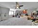 Large bonus room featuring neutral paint, carpet, and multiple ceiling fans for added comfort at 1166 Rocky River Rd, Lancaster, SC 29720