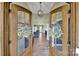 Home entrance with decorative doors and hardwood floors at 1166 Rocky River Rd, Lancaster, SC 29720
