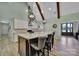 Bright kitchen with large island, granite countertops, stainless steel appliances and view to entry way at 1166 Rocky River Rd, Lancaster, SC 29720
