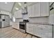 Modern kitchen featuring white cabinets, subway tile backsplash, and stainless steel appliances at 1166 Rocky River Rd, Lancaster, SC 29720