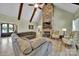 Bright living room featuring stone fireplace and cozy seating at 1166 Rocky River Rd, Lancaster, SC 29720