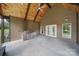 Covered outdoor patio features an outdoor kitchen and concrete flooring at 1166 Rocky River Rd, Lancaster, SC 29720