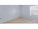 Cozy carpeted bedroom with ample natural light from a single window at 122 Dyssa Loop, Statesville, NC 28625