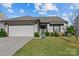 Charming single-story home with a two-car garage and beautifully landscaped front yard at 122 Dyssa Loop, Statesville, NC 28625