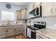 Updated kitchen featuring stainless steel appliances, granite counters and modern cabinets at 122 Dyssa Loop, Statesville, NC 28625