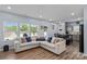 Bright living room with modern decor, comfortable seating, and ample natural light at 122 Dyssa Loop, Statesville, NC 28625