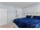 Spacious main bedroom with ensuite bathroom visible and plush bedding at 122 Dyssa Loop, Statesville, NC 28625