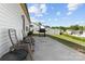 Concrete patio offers a great outdoor area with lawn, fence, grill, and chairs at 122 Dyssa Loop, Statesville, NC 28625