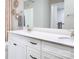 Well-lit bathroom featuring double sinks, sleek white cabinetry, and modern fixtures at 12309 Gambrell Dr, Charlotte, NC 28278