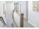 Upstairs hallway featuring modern staircase, neutral paint colors, and natural light at 12309 Gambrell Dr, Charlotte, NC 28278