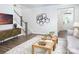 Contemporary living room showcasing hardwood floors, modern furniture, and a staircase leading to upper levels at 12309 Gambrell Dr, Charlotte, NC 28278