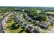 Aerial view of a residential neighborhood featuring single-Gathering homes with green lawns and tree-lined streets at 12724 Frank Wiley Ln, Charlotte, NC 28278