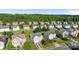 Aerial view of the neighborhood showcases a beautiful, tree-lined community at 12724 Frank Wiley Ln, Charlotte, NC 28278