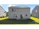 The backyard features a patio and lush lawn at 12724 Frank Wiley Ln, Charlotte, NC 28278