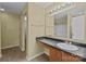 Bathroom features a single sink vanity, laminate flooring, and a shower-tub combo at 12724 Frank Wiley Ln, Charlotte, NC 28278