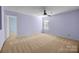Lavender bedroom with ceiling fan and carpet at 12724 Frank Wiley Ln, Charlotte, NC 28278