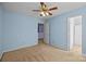 Light blue bedroom with ceiling fan and carpet at 12724 Frank Wiley Ln, Charlotte, NC 28278