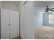 Neutral bedroom features a ceiling fan, a double window, and closet space at 12724 Frank Wiley Ln, Charlotte, NC 28278