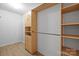 Walk-in closet with built-in storage and custom shelving at 12724 Frank Wiley Ln, Charlotte, NC 28278