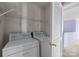 Upstairs laundry room features shelving for storage at 12724 Frank Wiley Ln, Charlotte, NC 28278