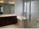 Bathroom featuring double vanity, large tub and glass enclosed shower at 13123 Ashley Meadow Dr, Charlotte, NC 28213