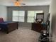 View of bedroom with dresser, TV, and carpet flooring at 13123 Ashley Meadow Dr, Charlotte, NC 28213