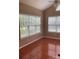 Bedroom with neutral-toned walls and natural light coming through windows, overlooking the outdoor landscape at 13123 Ashley Meadow Dr, Charlotte, NC 28213