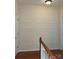 View of hallway with hardwood floors and decorative paneling at 13123 Ashley Meadow Dr, Charlotte, NC 28213