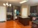 View of kitchen with stainless steel appliances, granite countertops, dark cabinetry, and hardwood floors at 13123 Ashley Meadow Dr, Charlotte, NC 28213