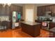 View of kitchen with stainless steel appliances, granite countertops, dark cabinetry, and hardwood floors at 13123 Ashley Meadow Dr, Charlotte, NC 28213